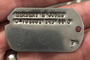 Photo of original military 1943 US Army Dog Tags issued to Captain Herbert E Jones
