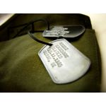 Rusty Steel Dog Tag debossed with green canvas sac