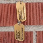 Notched Gold plated Dog Tags with darkened debossed lettering