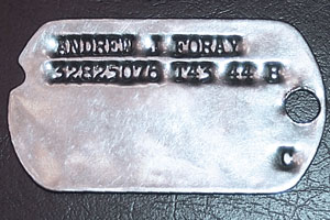 Photo of original military 1943 US Army Dog Tags issued to Andrew J Foray