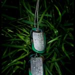 Mil-Spec Shiny Dog Tag set on plant