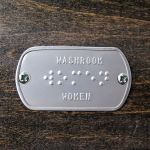 'WOMEN' Braille washroom sign