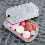 Dogtag Pillbox with list of medication contents, after carrying in pocket for 1 year