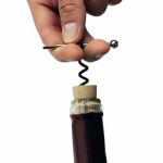 Mini Corkscrew removing cork from wine bottle