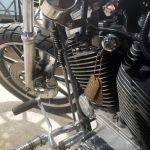 Rusty Steel Dog Tag as keychain on vintage Harley motorcycle