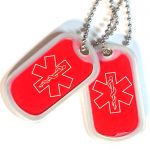 Clear Dog Tag Silencer on Dogtags with Star of Life stickers