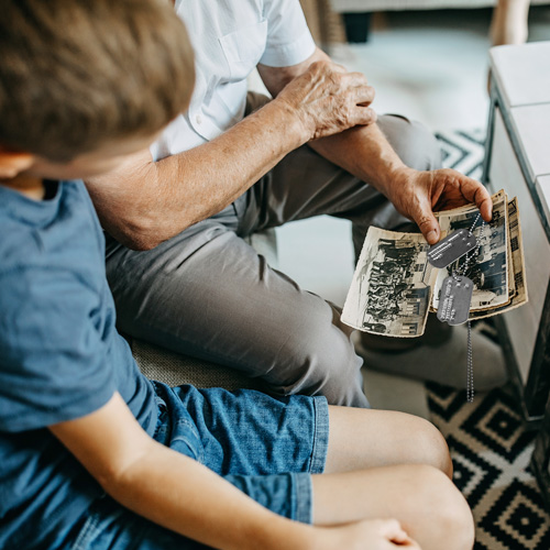 Veteran giving his Dog Tags to his grandson
